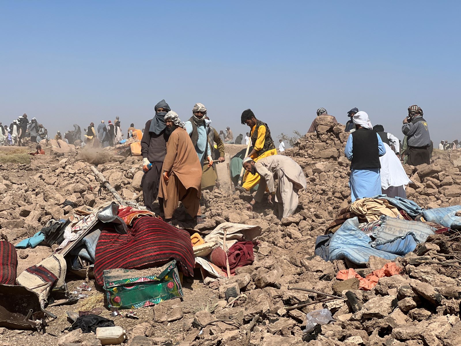 People search among the rubble after an earthquake in Afghanistan