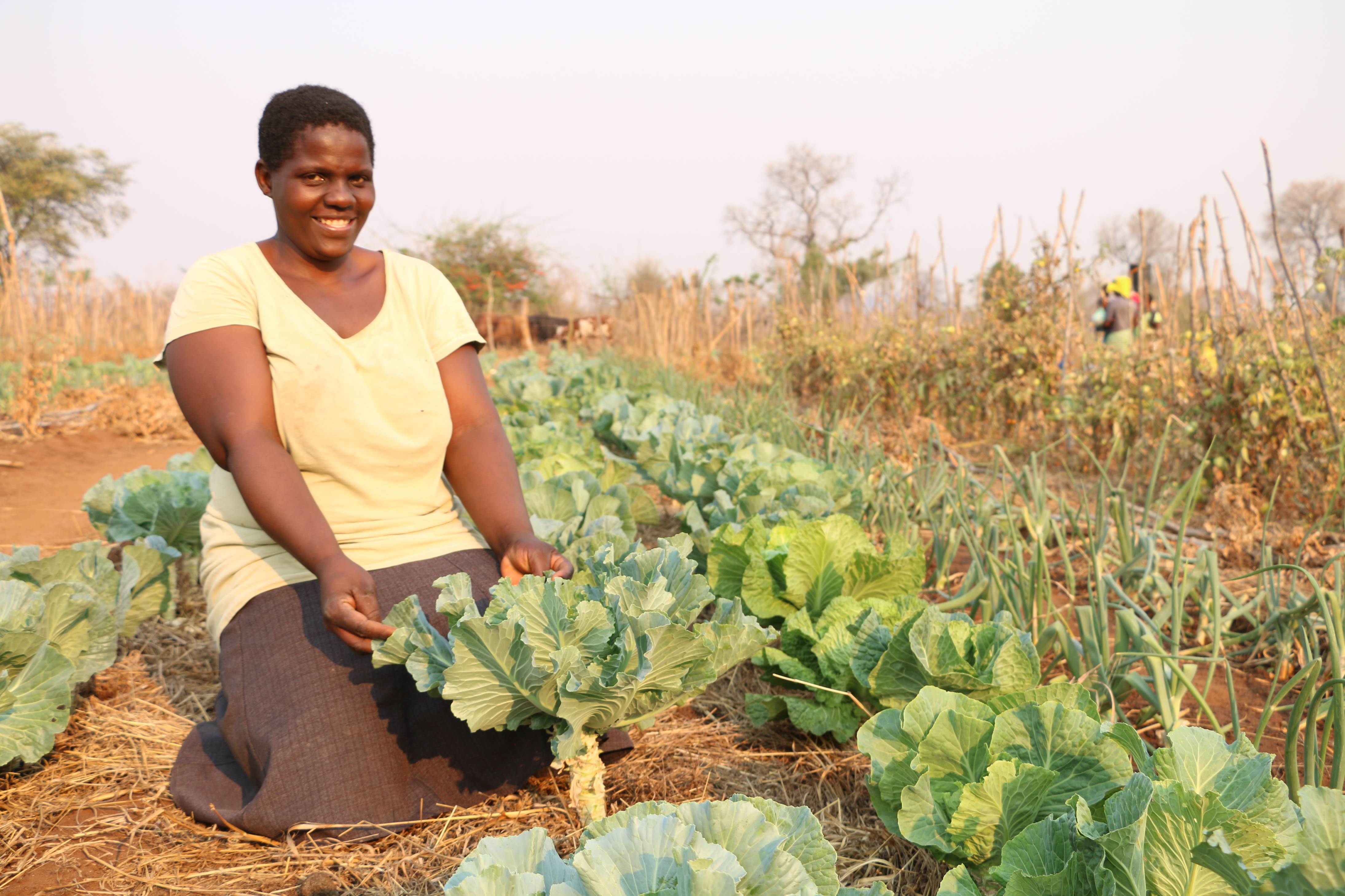 Woman with crops in Zimbabwe