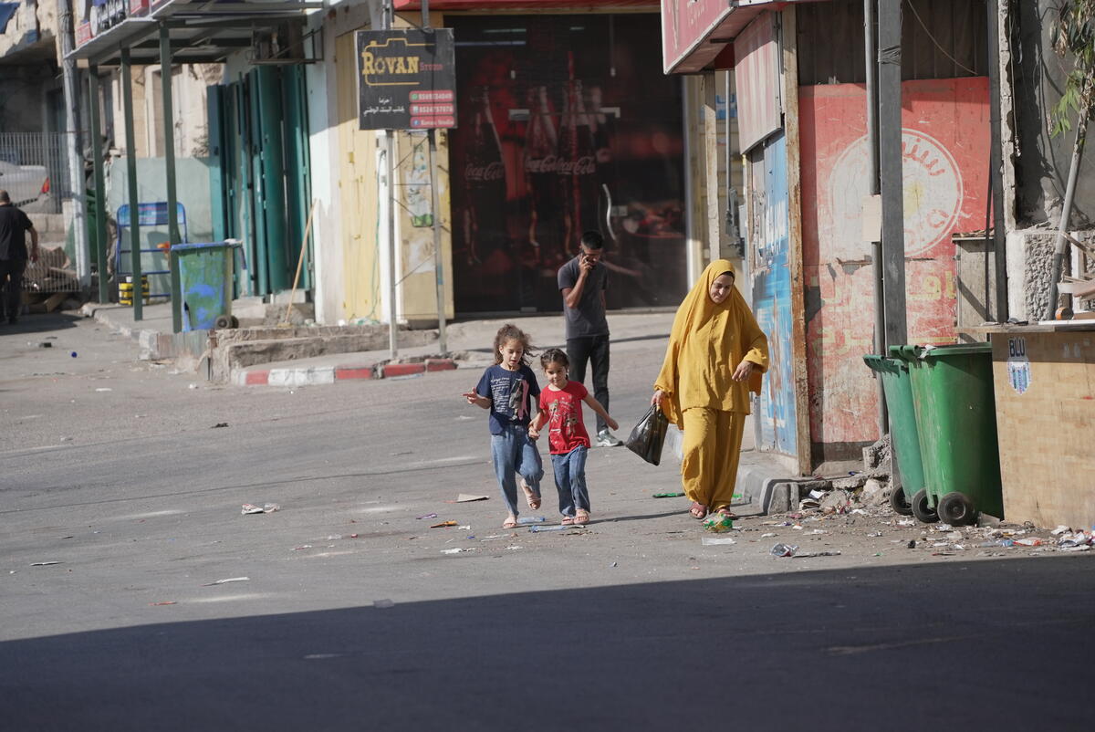 A family walk along a deserted street
