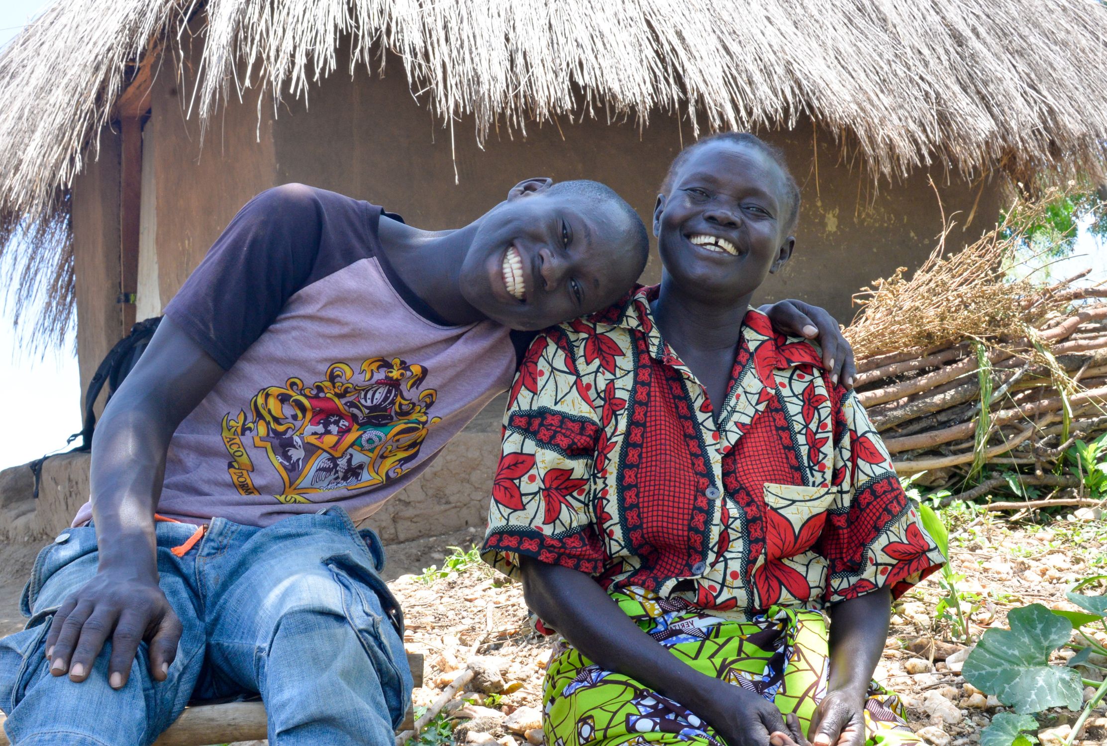 Ugandan refugees, mother and son smiling