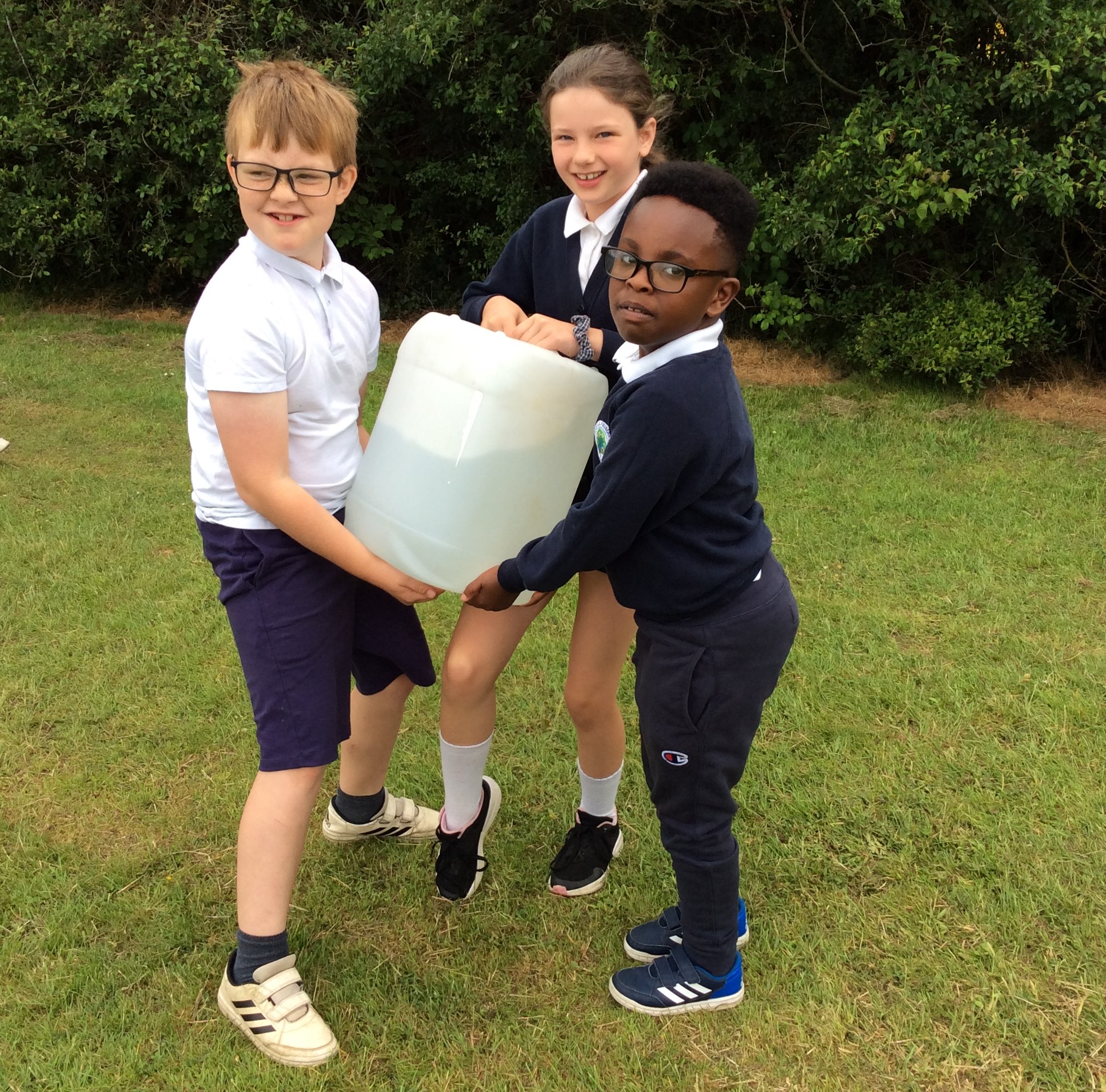 Children from a Buckinghamshire primary school carry a heavy load of water