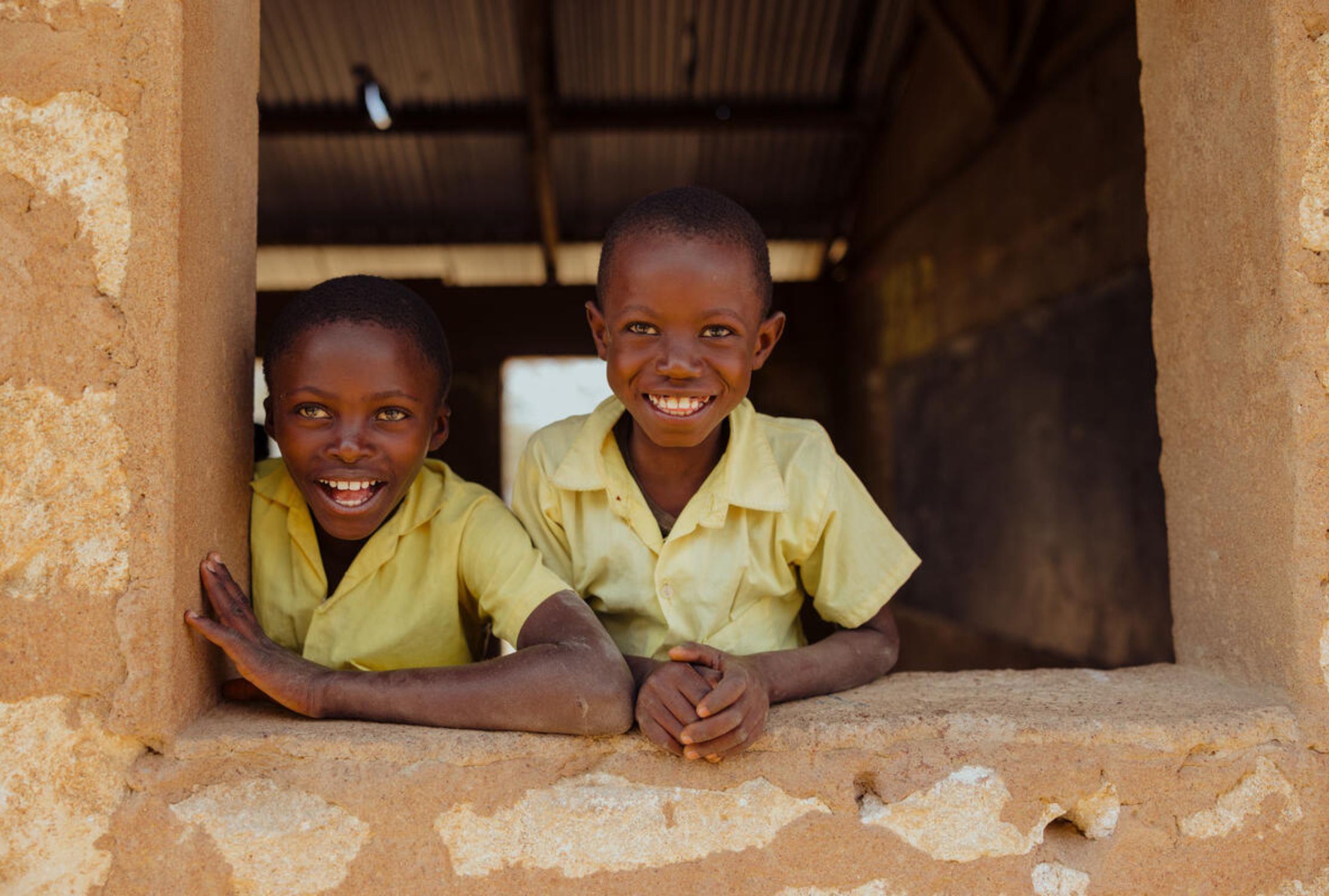 A Kenyan girl and boy smiling