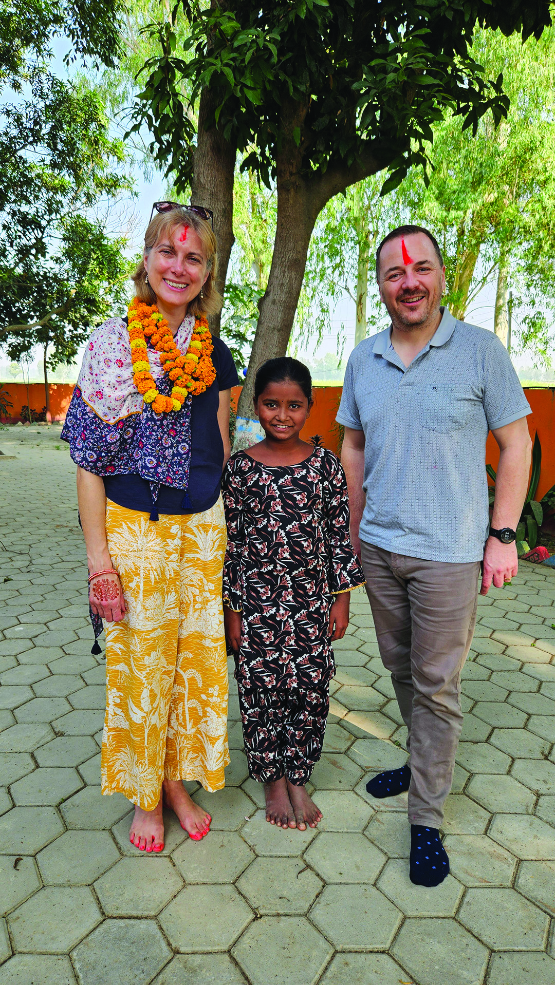 Helen and Pete pose with their sponsored child. Sabirin, in Nepal