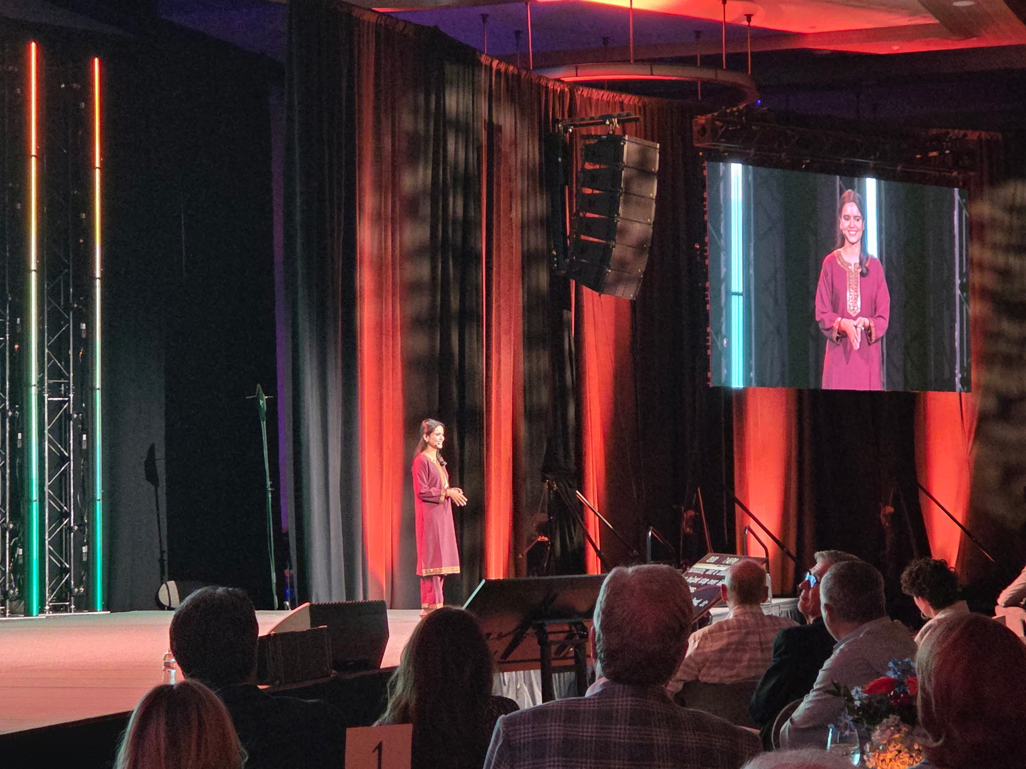 Dola sharing her story with 400 people at Everyone Needs a Believer.