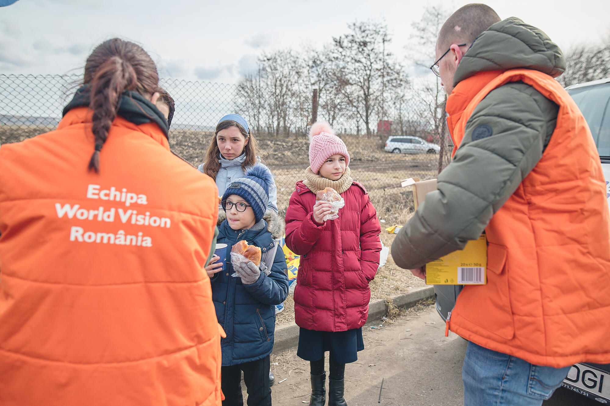 World Vision Romania staff speak to children on the border