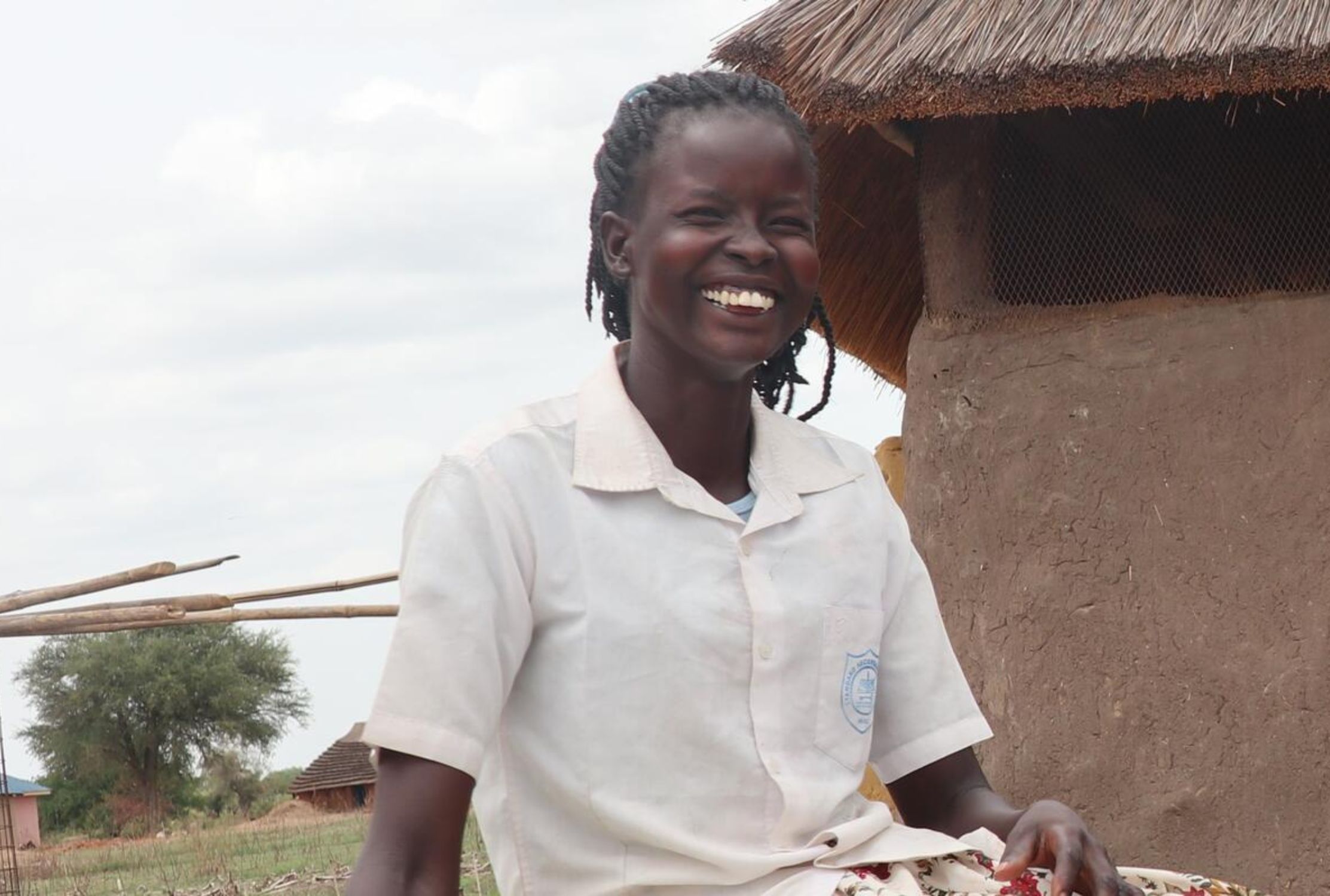 A girl in South Sudan smiling at the camera