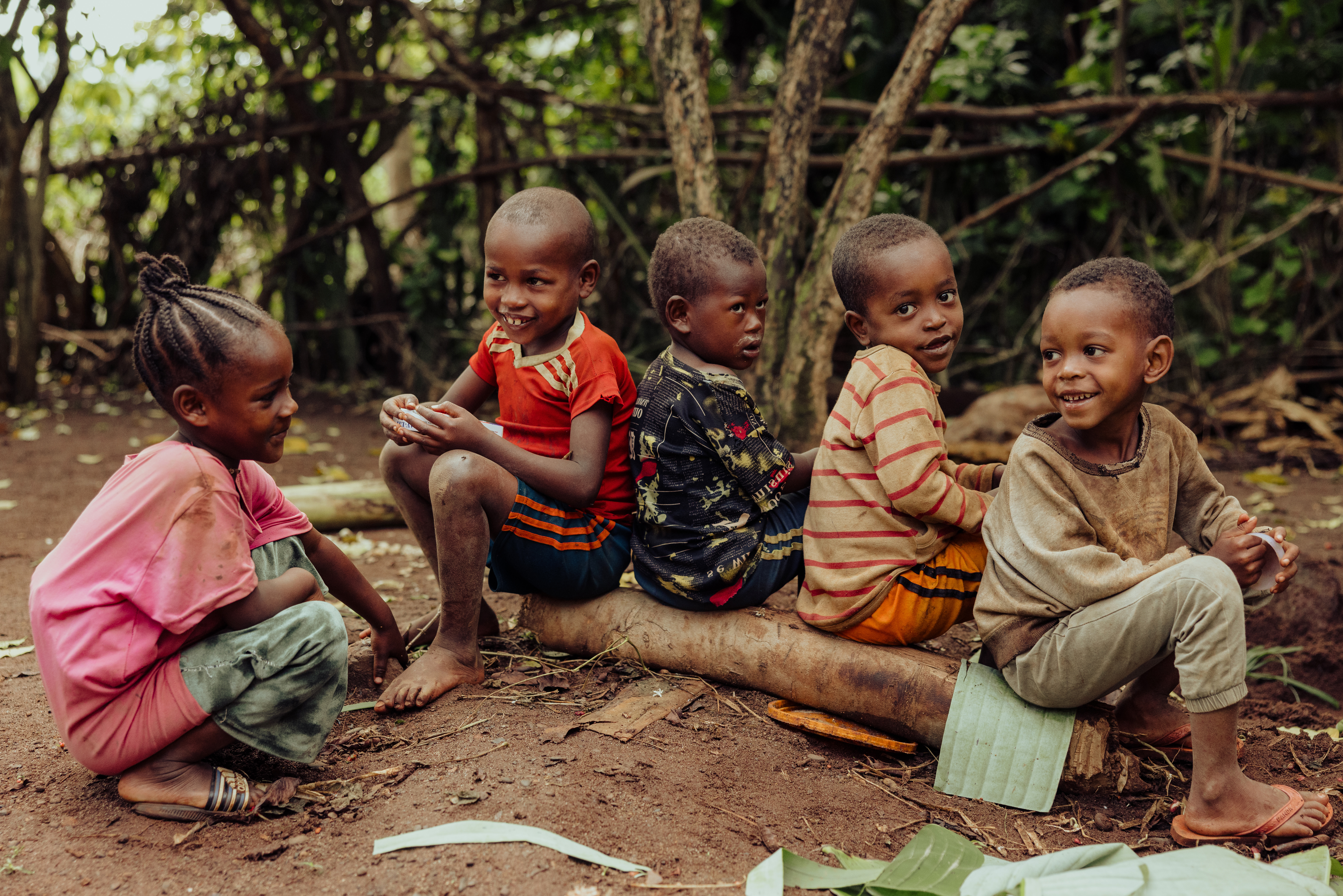 Five children in a sponsored community in Ethiopia smile to the camera