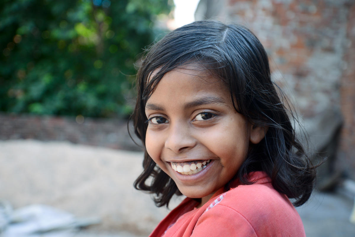 Former child worker Sonali smiles at the camera