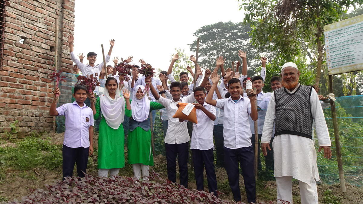 Group of boys and girls from Bangladesh celebrating their community work