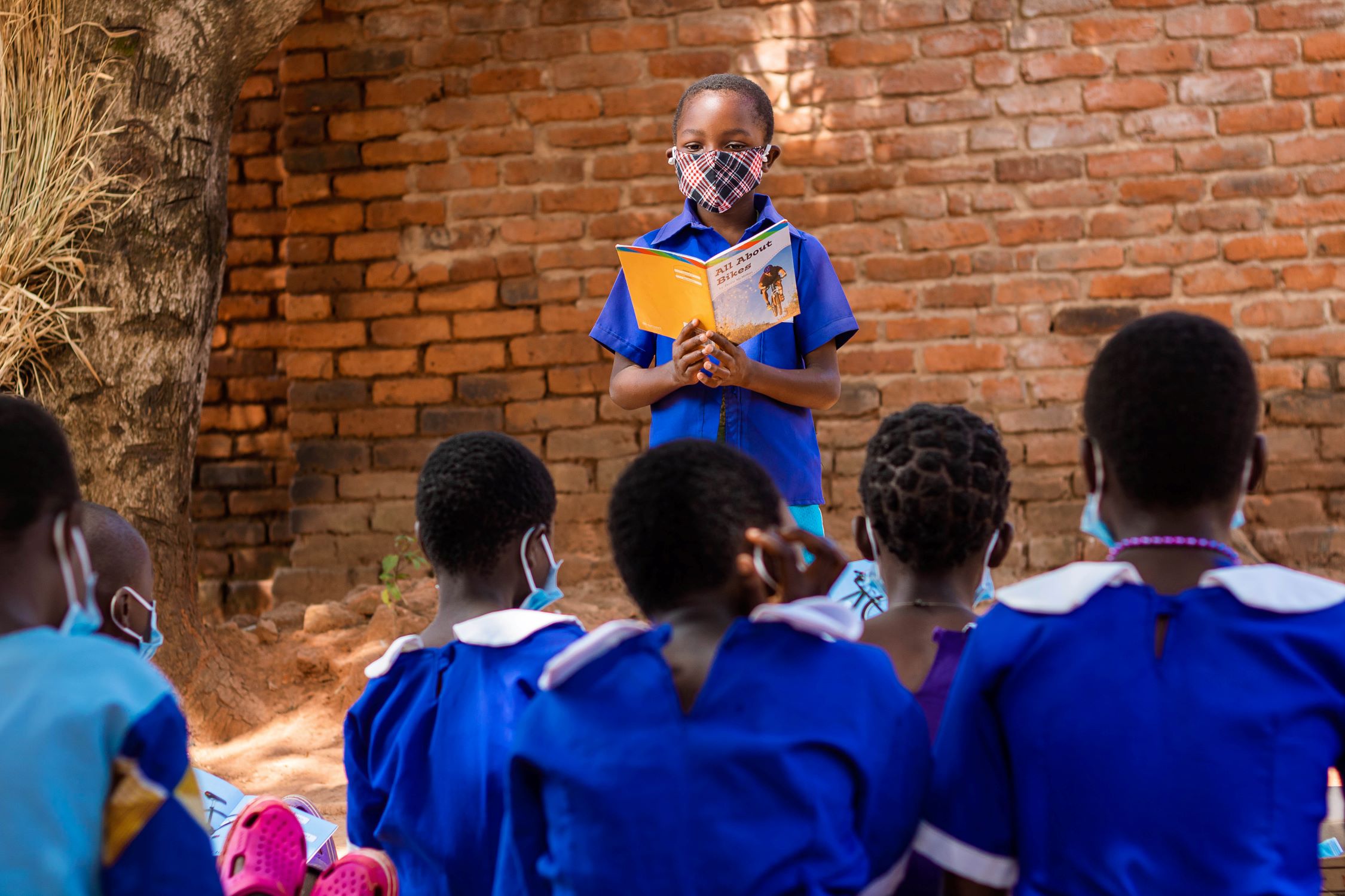 Phillip teaches his friends in Malawi