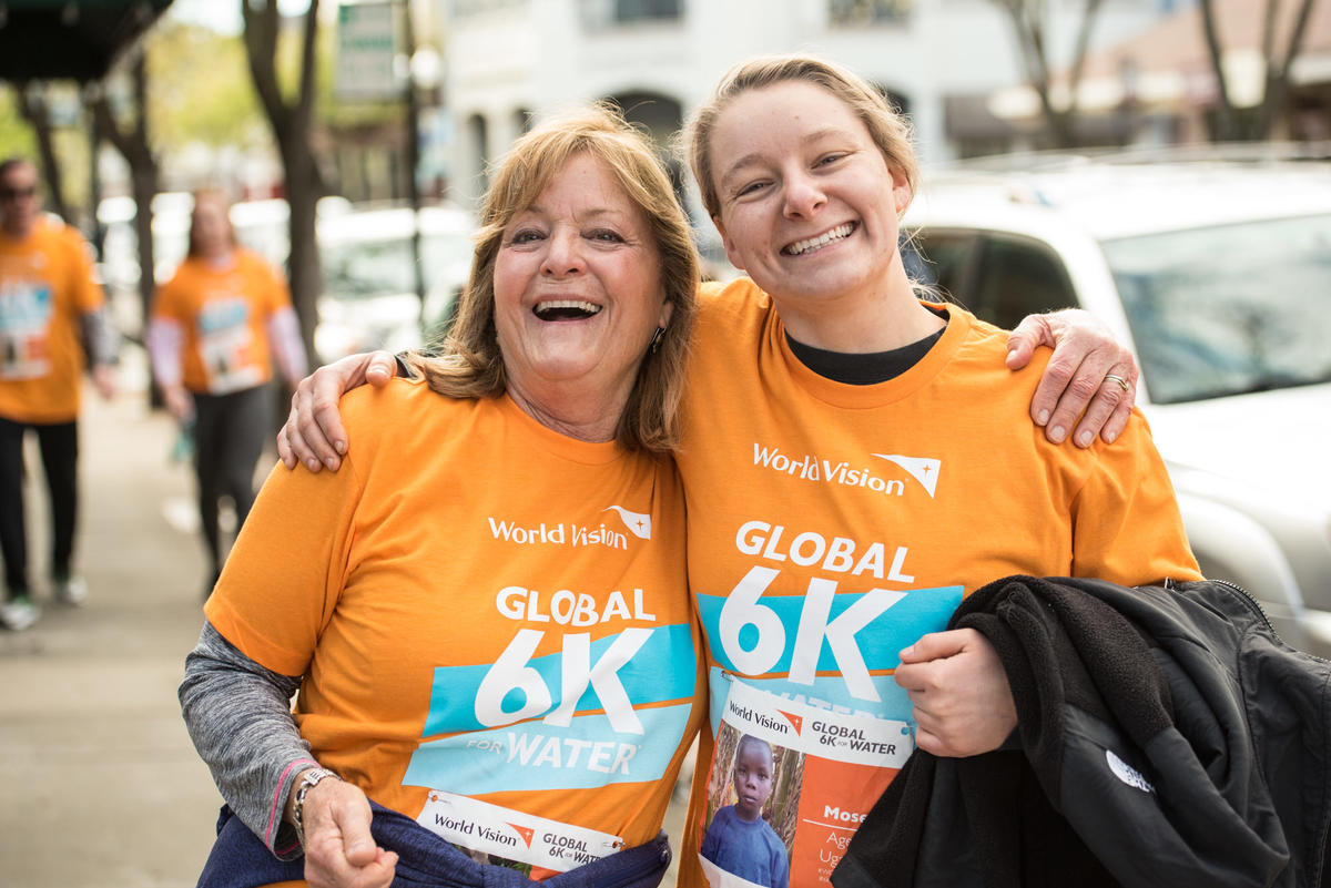 Two ladies in  Global 6K Walk for Water t-shirts.
