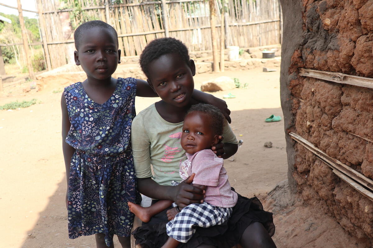 11-year-old Paska looks after her sisters; 7-year-old Sarah and 8-month-old Rose.
