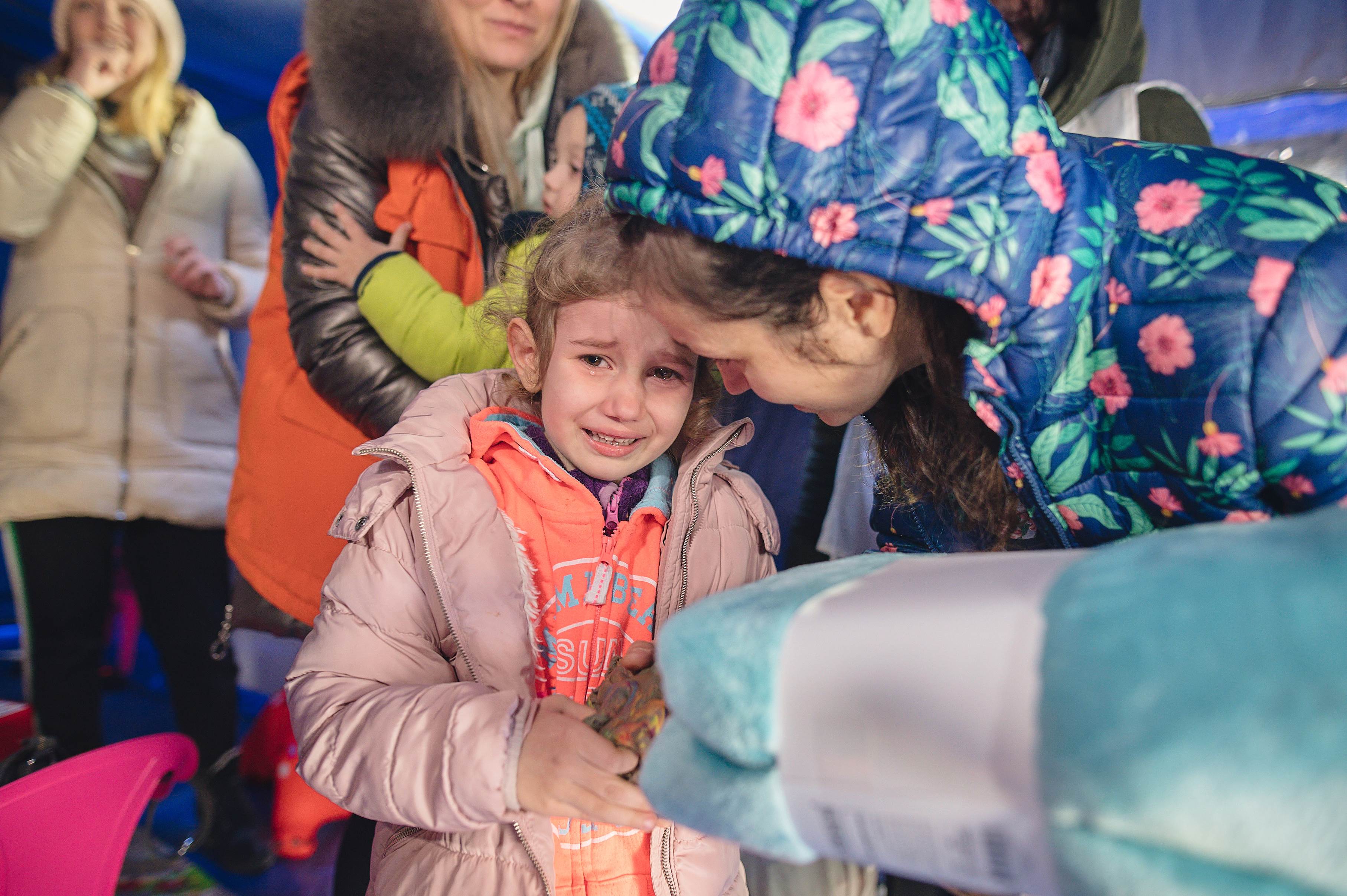 Young Ukrainian girl crying in a child friendly space