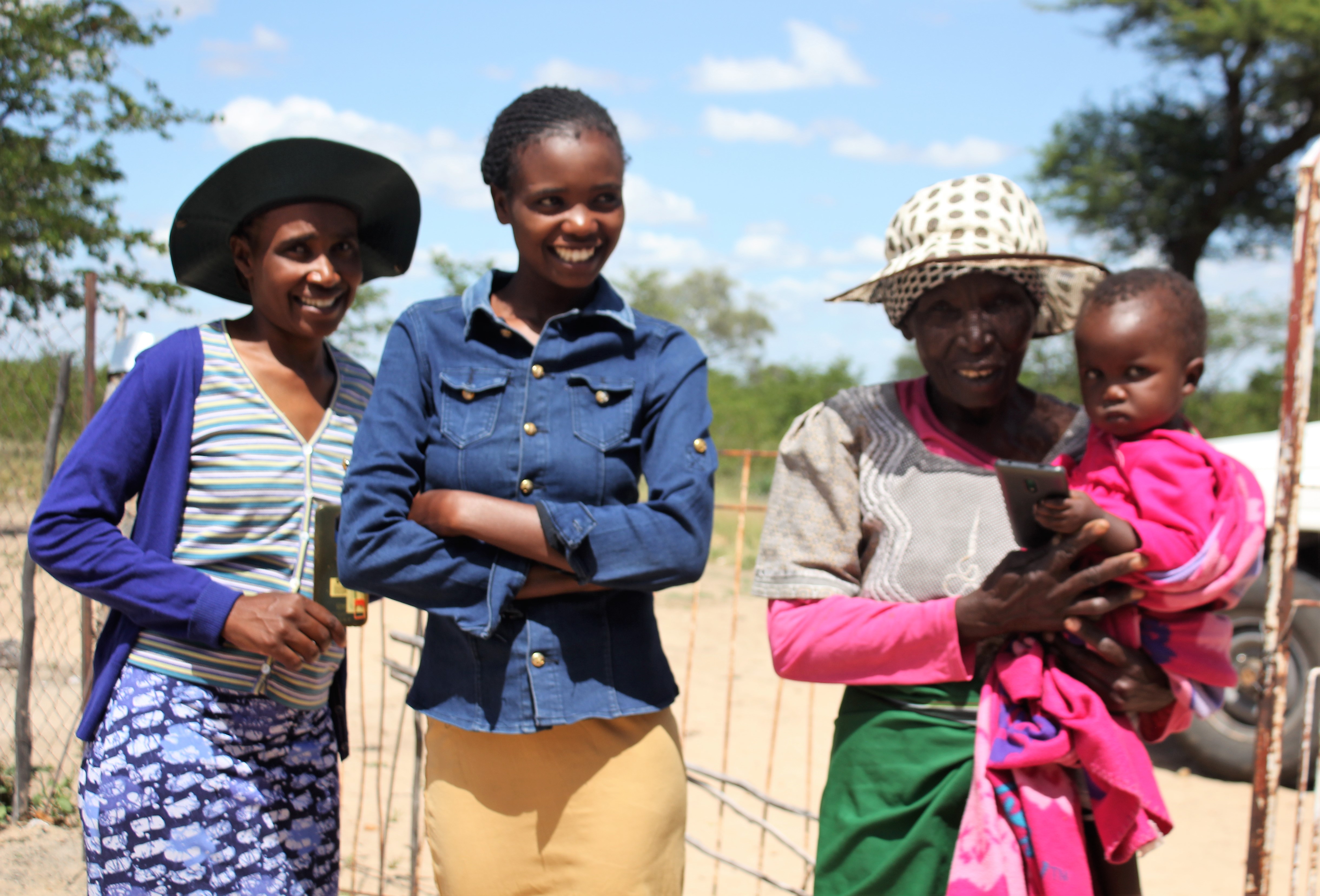 Four generations of women from one family pose together in Zimbabwe