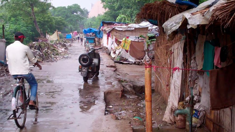 Street dwellings are flooded by monsoon rains in India