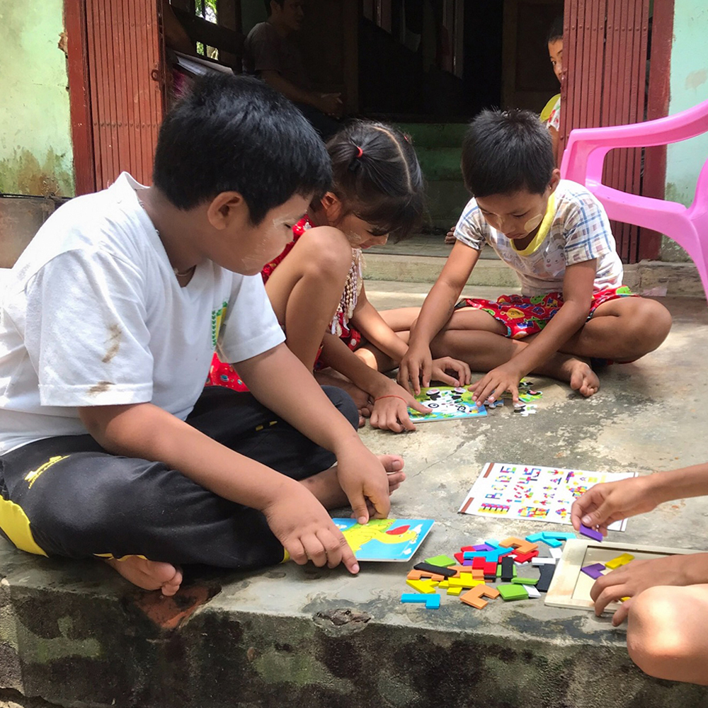 Children playing with toys on the floor