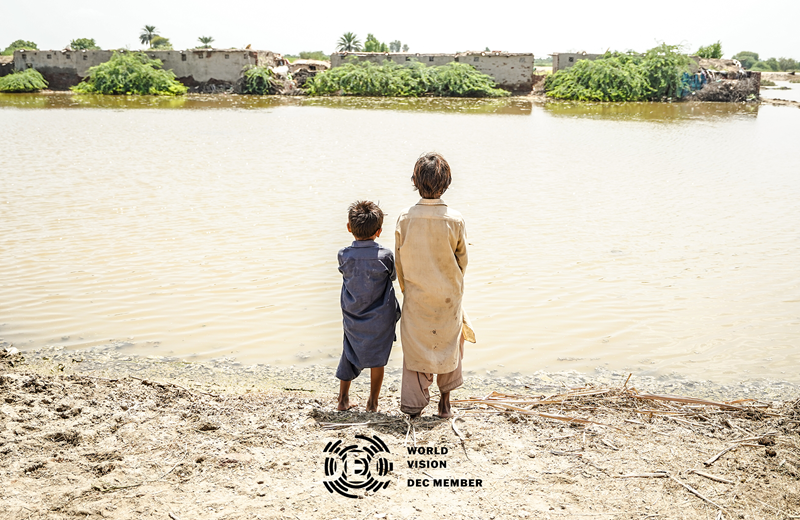 Children looking at flood in Pakistan