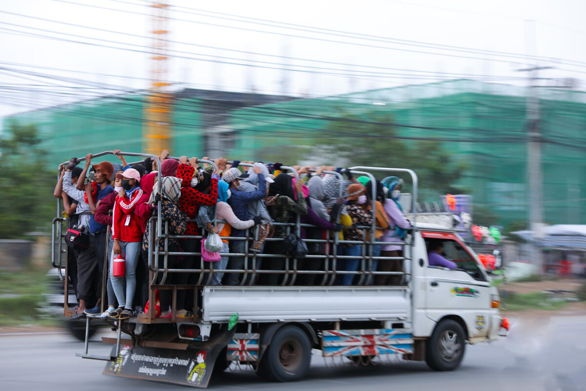 People in a truck going to work in Cambodia's factories