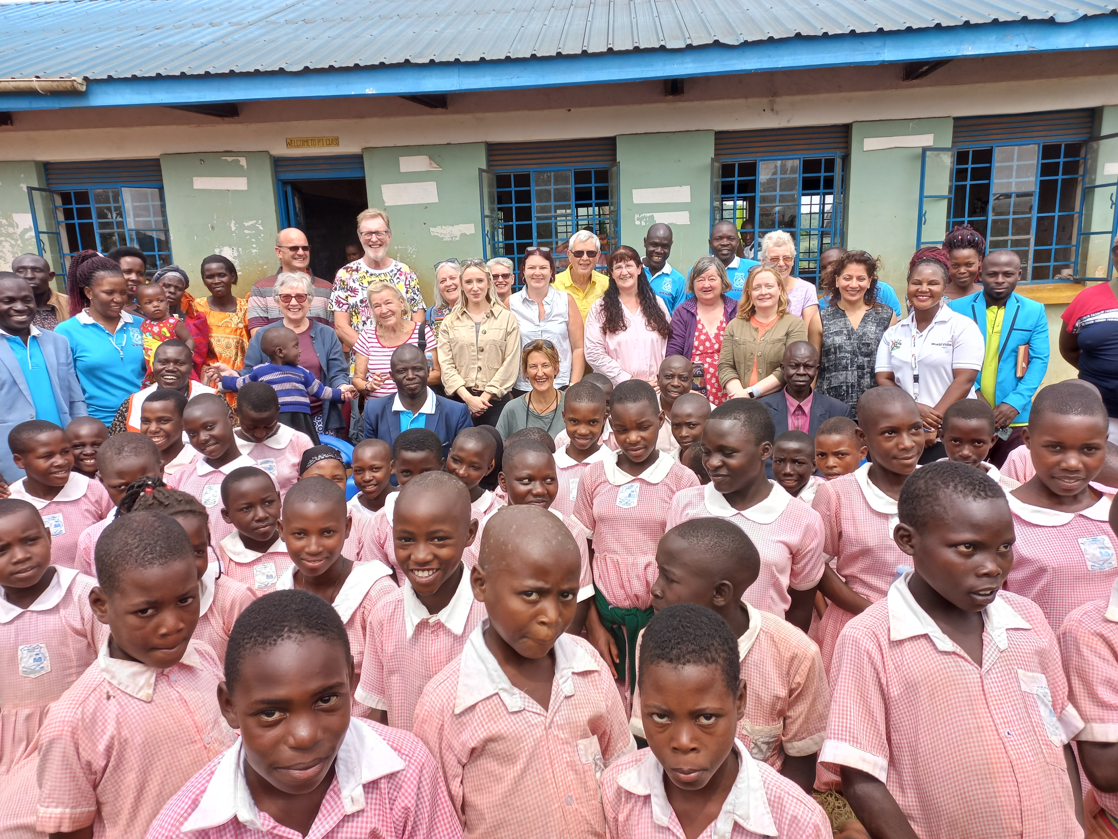 Students at a primary school meet child sponsors, Uganda