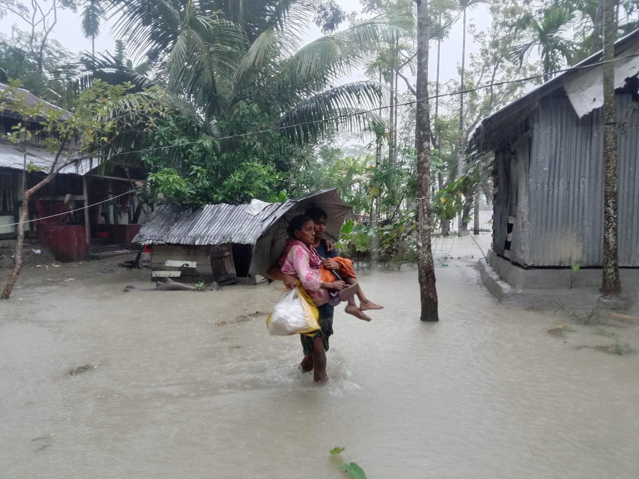 Elderly woman is being evacuated to a Cyclone Centre