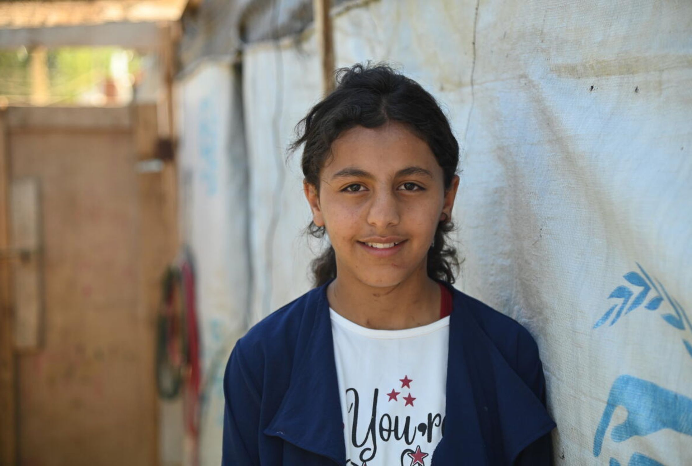 Lebanese girl refugee smiling at the camera