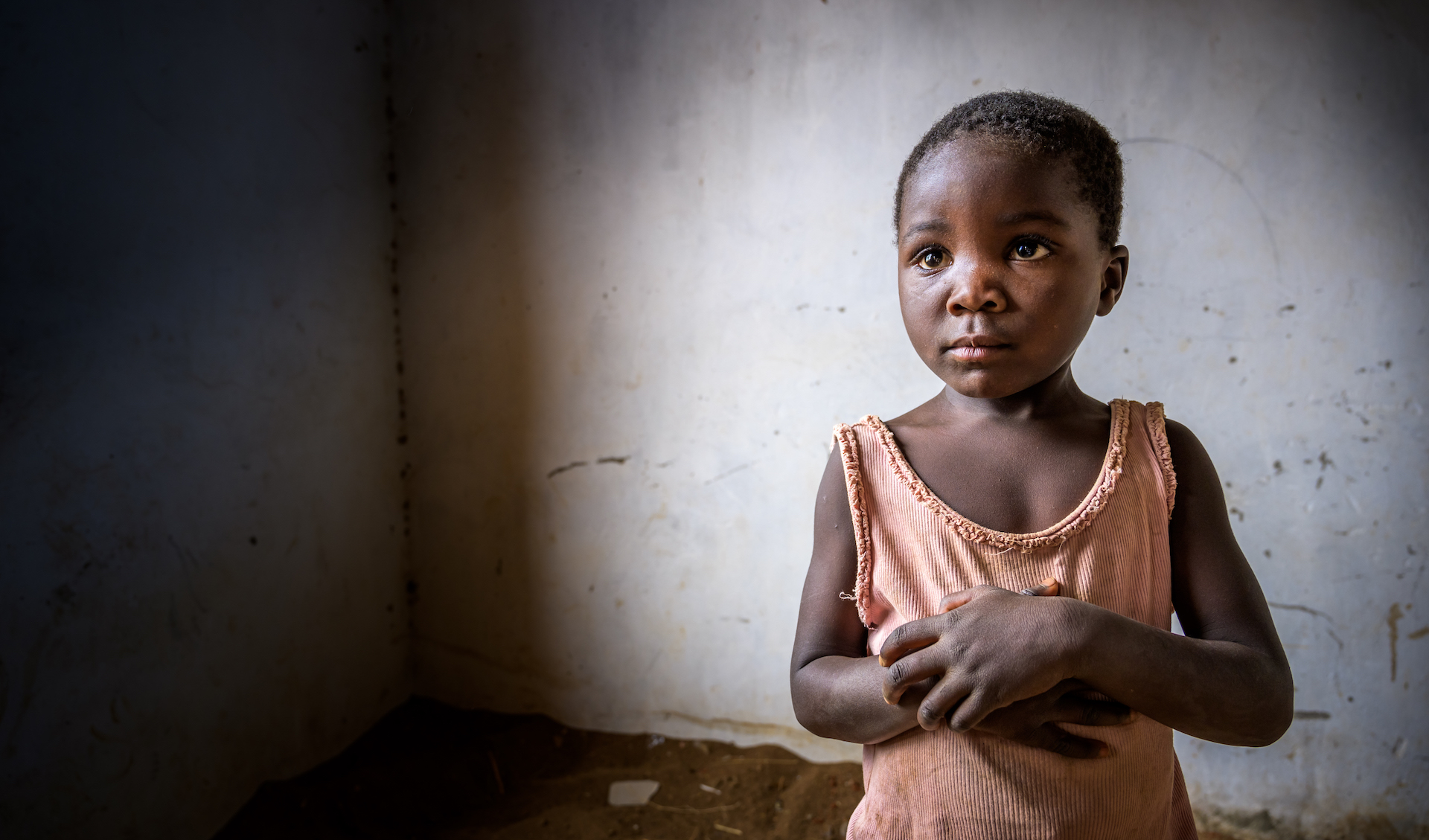 Child standing in her home