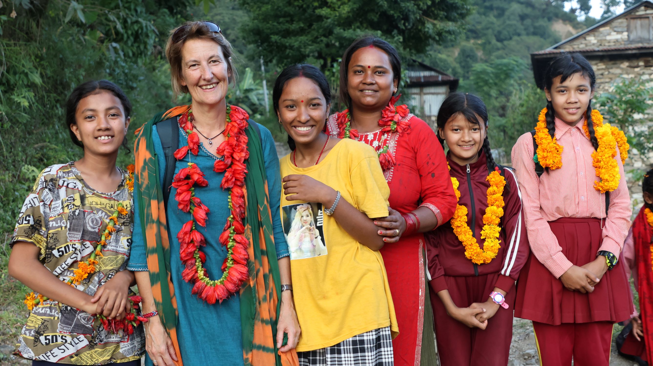 Community in Nepal with a World Vision UK staff member