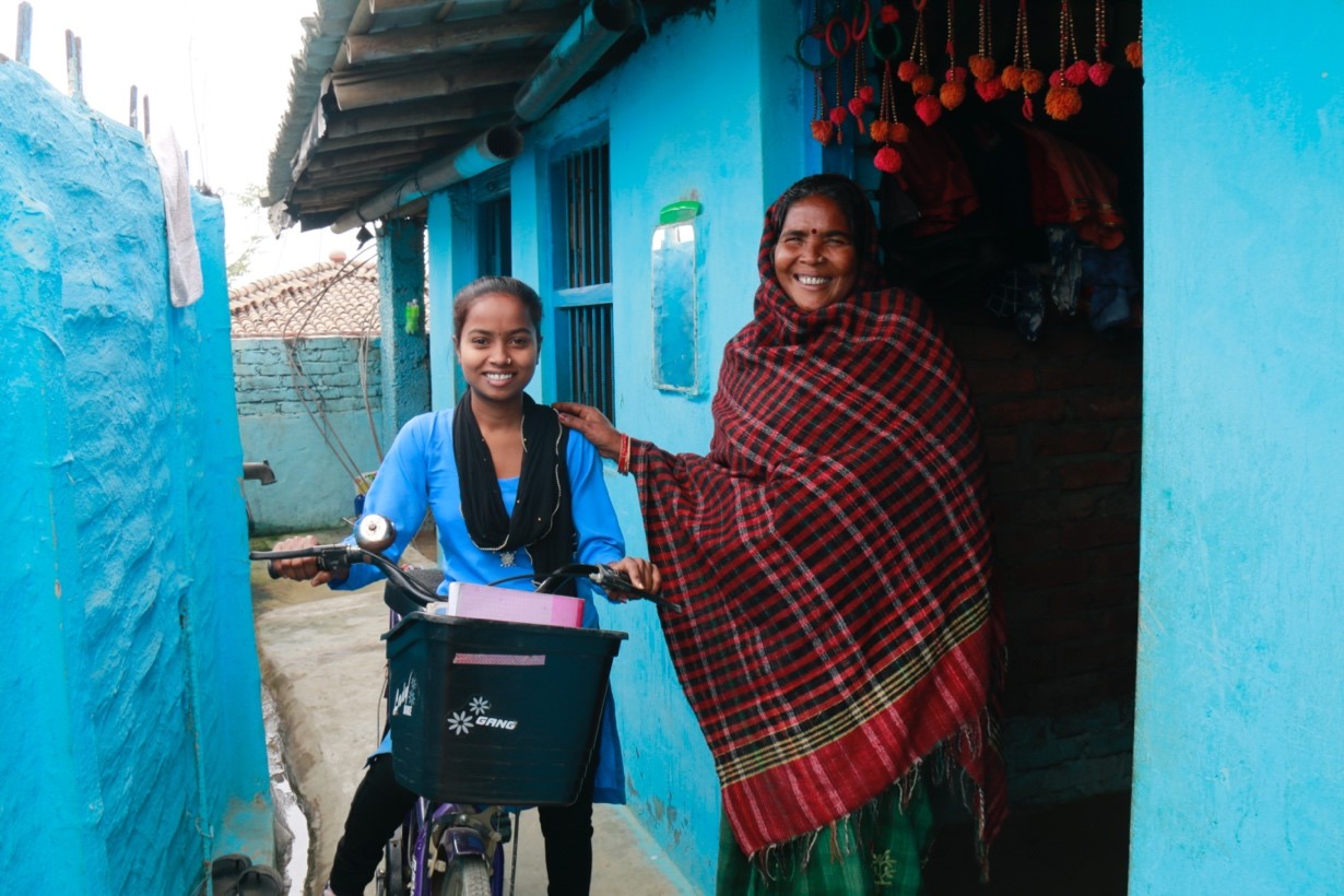 Girl with bike going to school