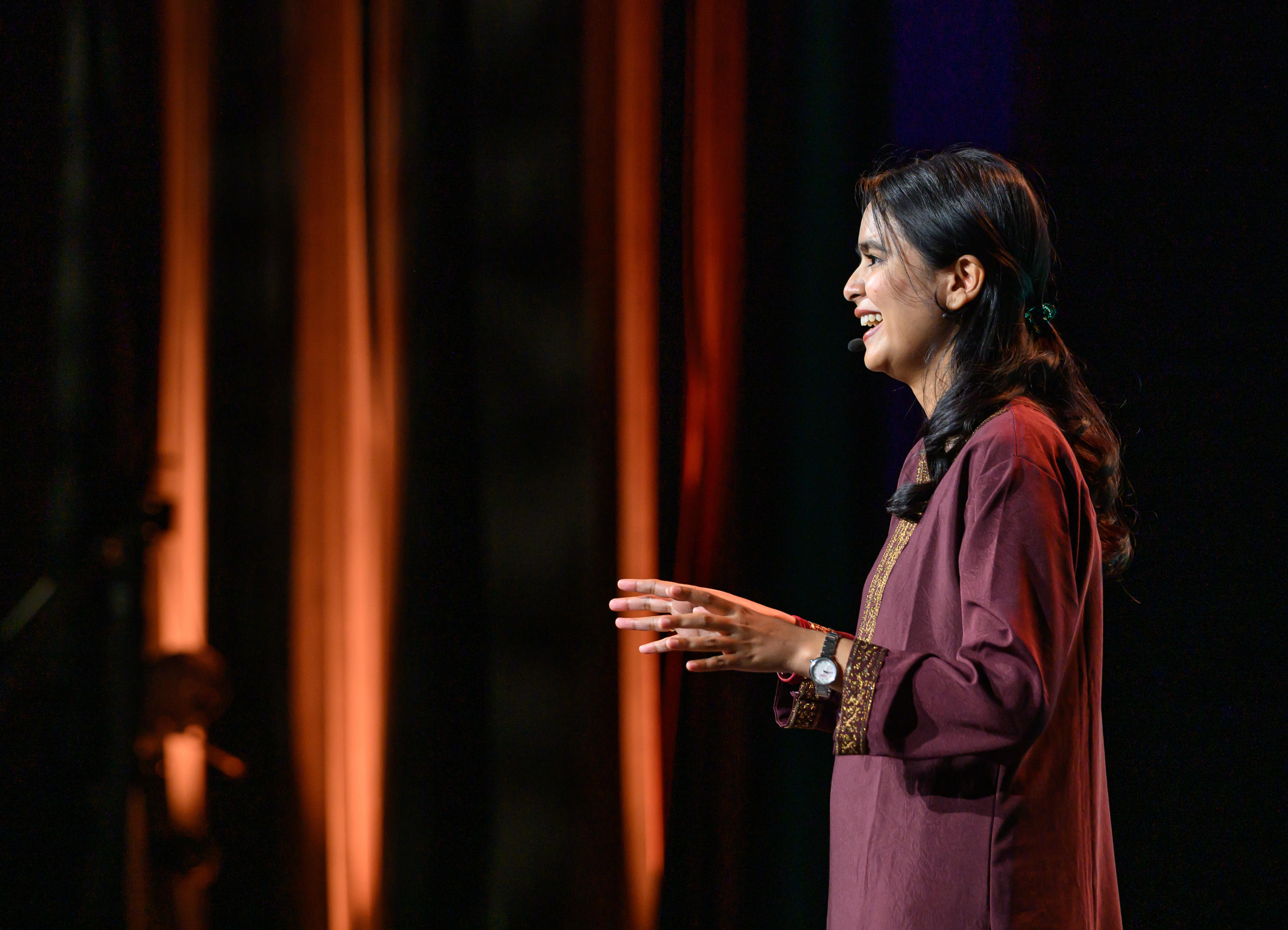 Dola speaking at the Strong World at the HER VOICE. HER FUTURE.
