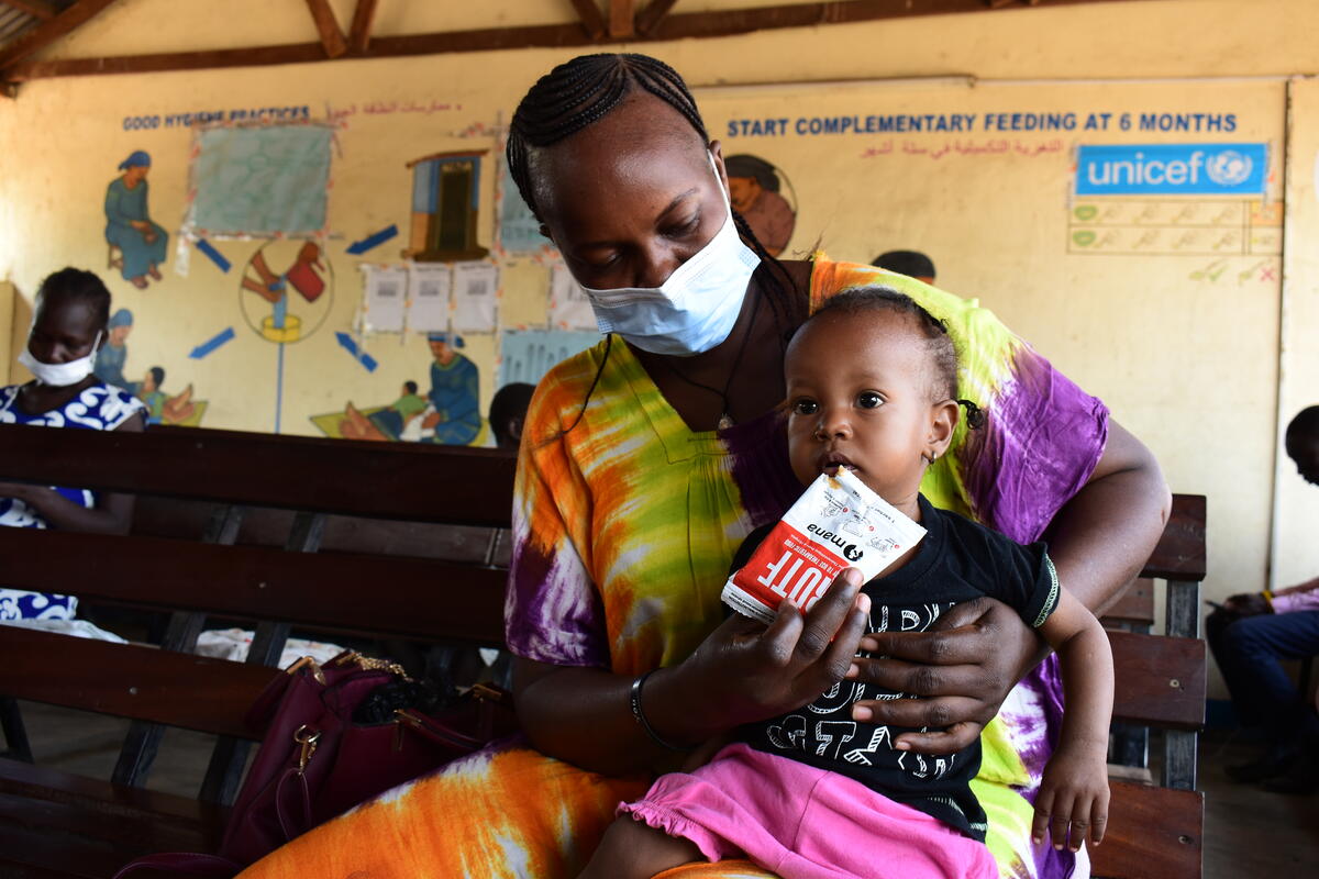 A young child is fed nutritious food