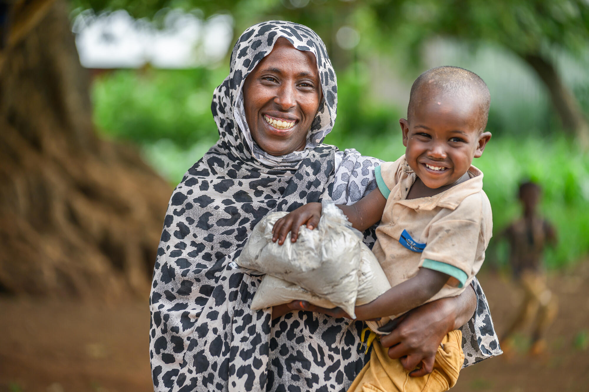 Laila and her son, Arjoma smile now that Arjoma has the right nutritional support