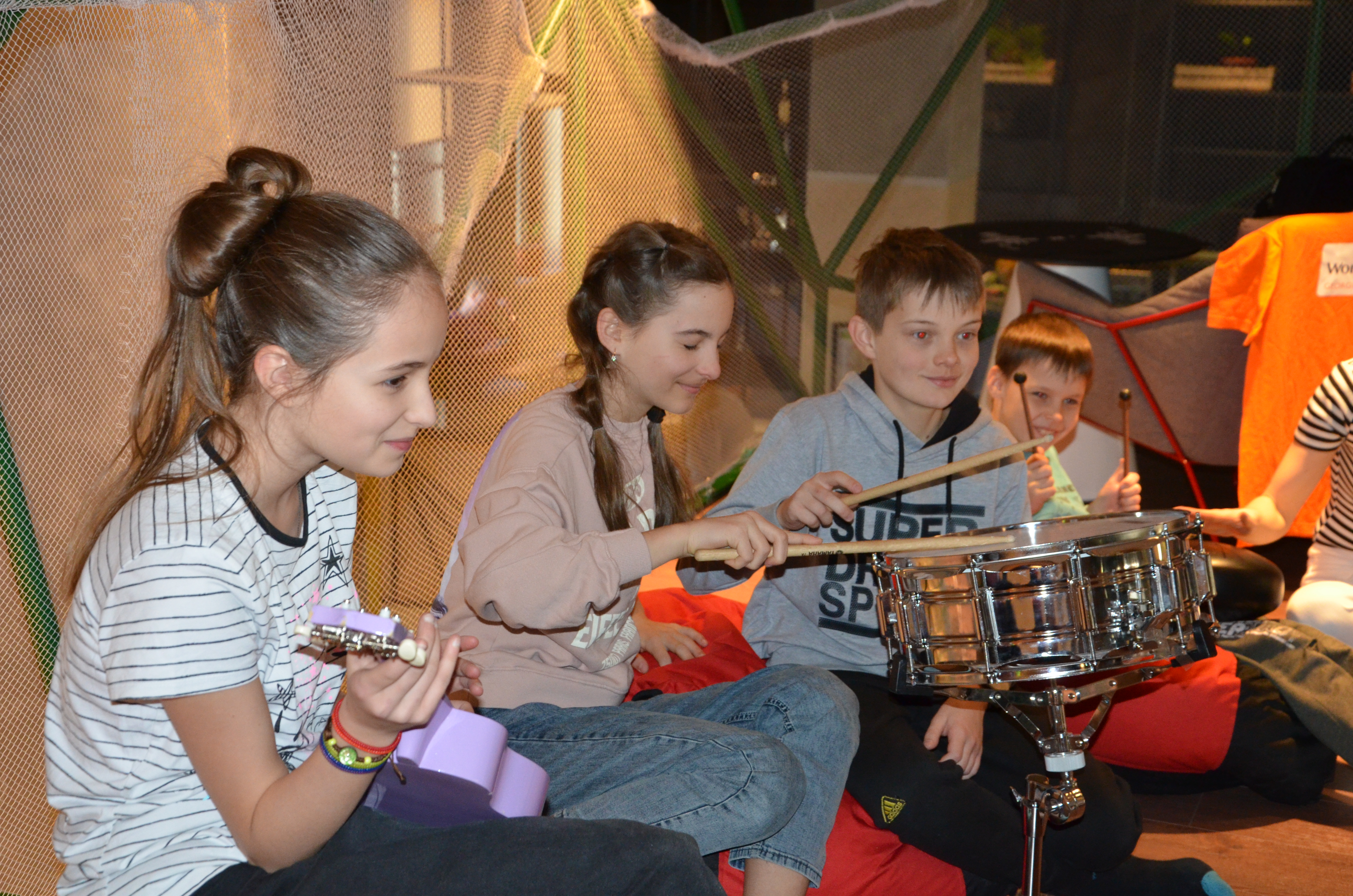 Children from Ukraine take part in a music therapy session