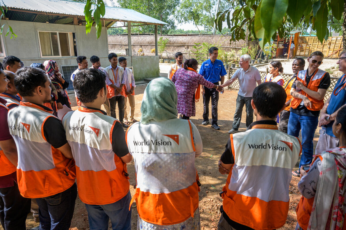 World vision staff members stand in a big group in Bangladesh