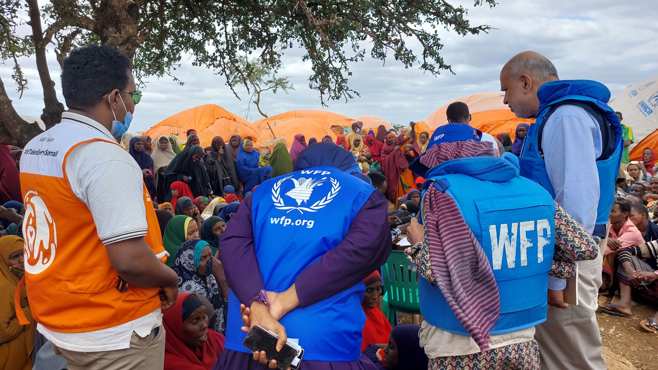 World Vision staff member stands with World Food Programme staff in Somalia