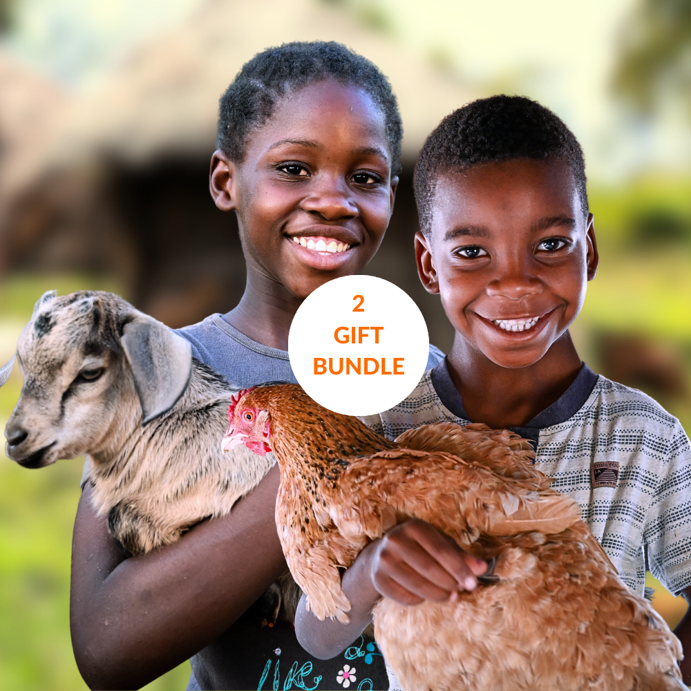 Girl holding goat and boy holding chicken