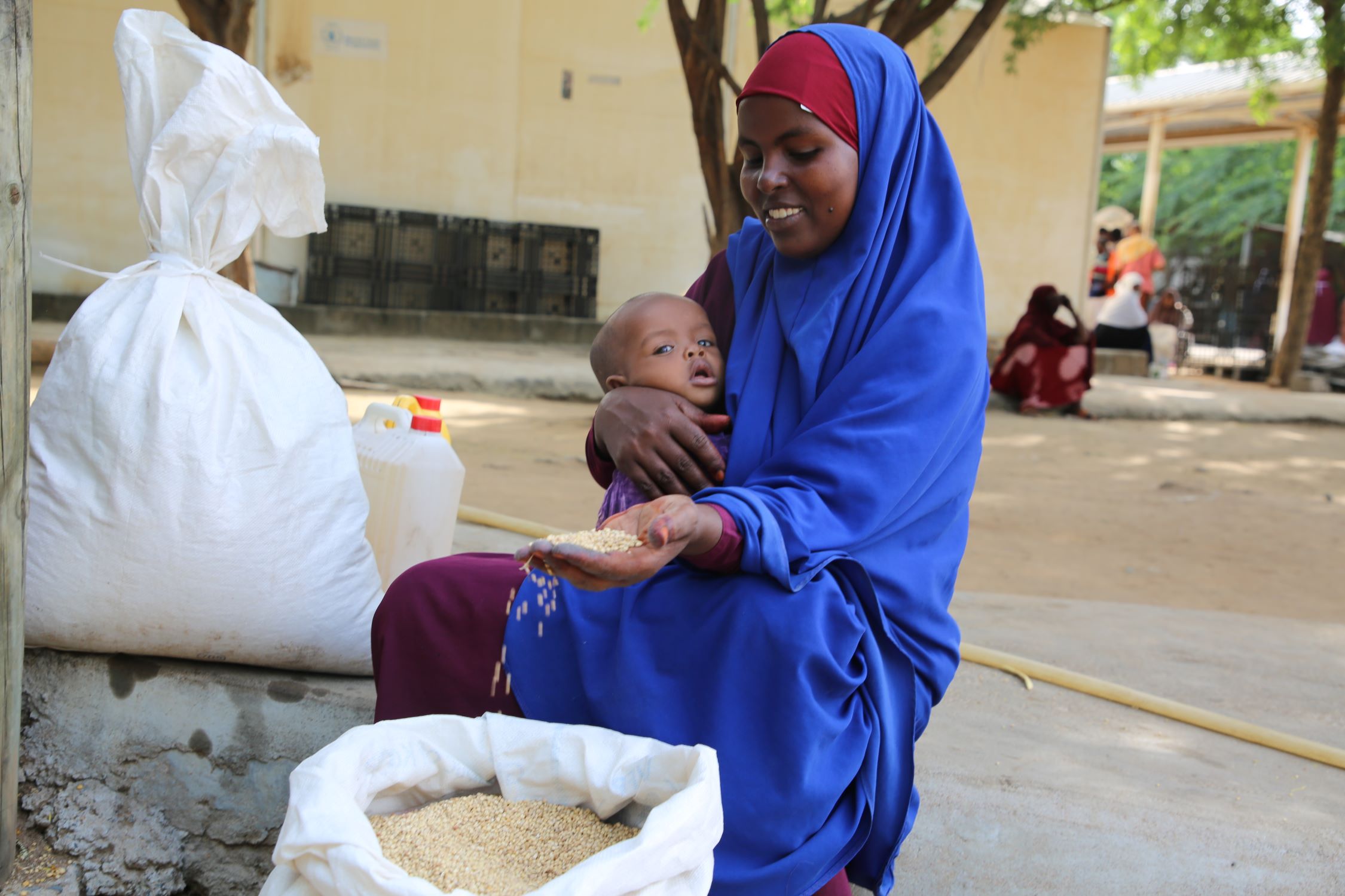 Refugee in Kenya receiving food in 2022