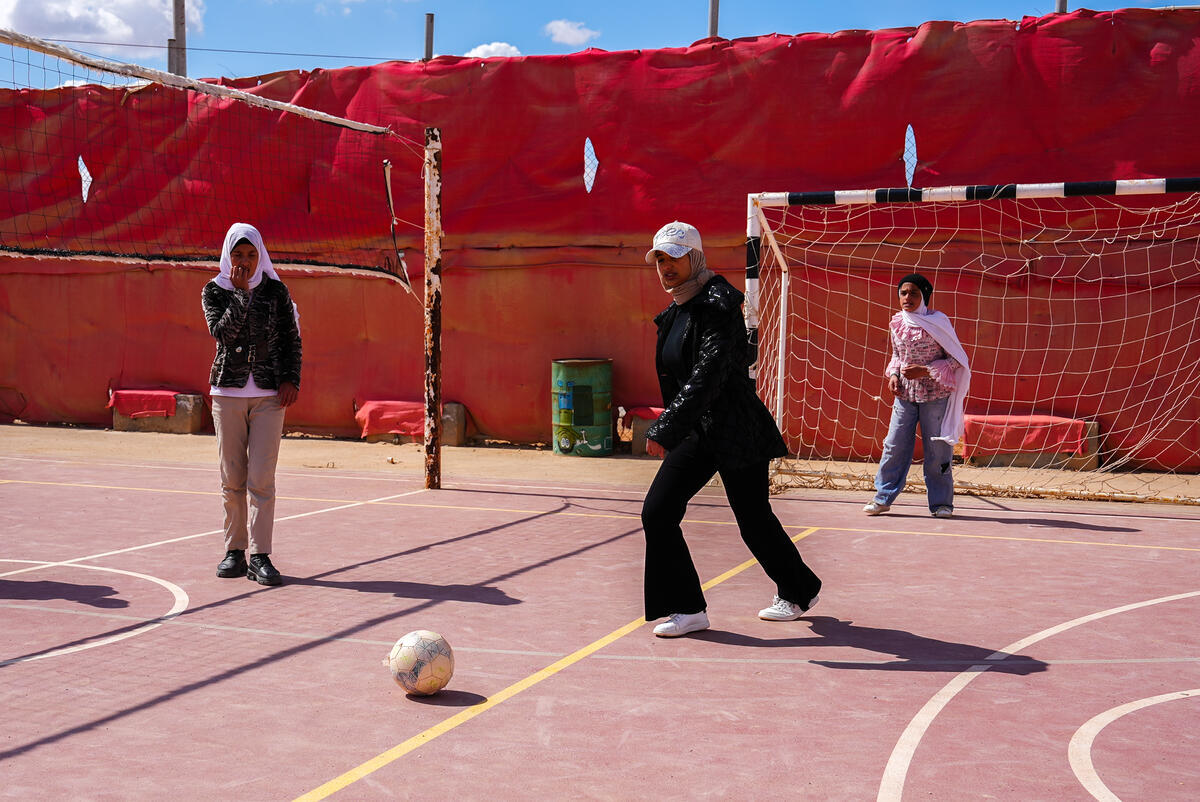 young girls playing football