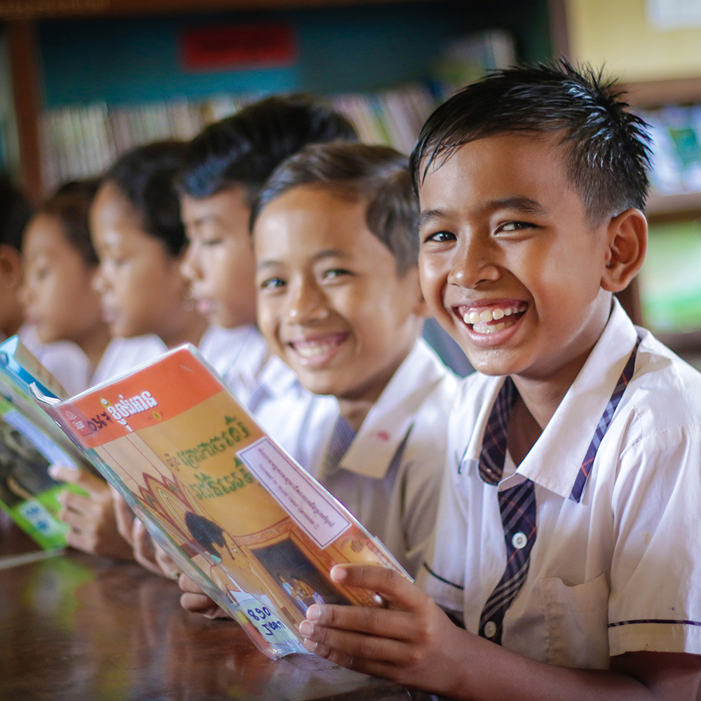 Children in classroom reading