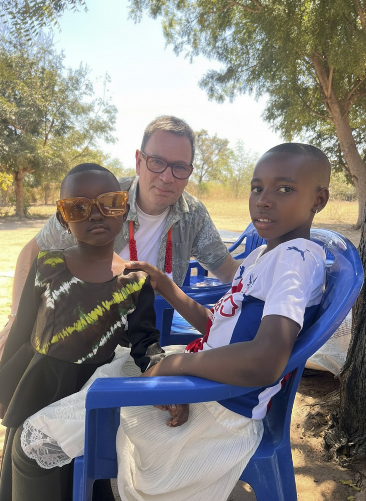 David meets his sponsored child and her younger sister in Tanzania