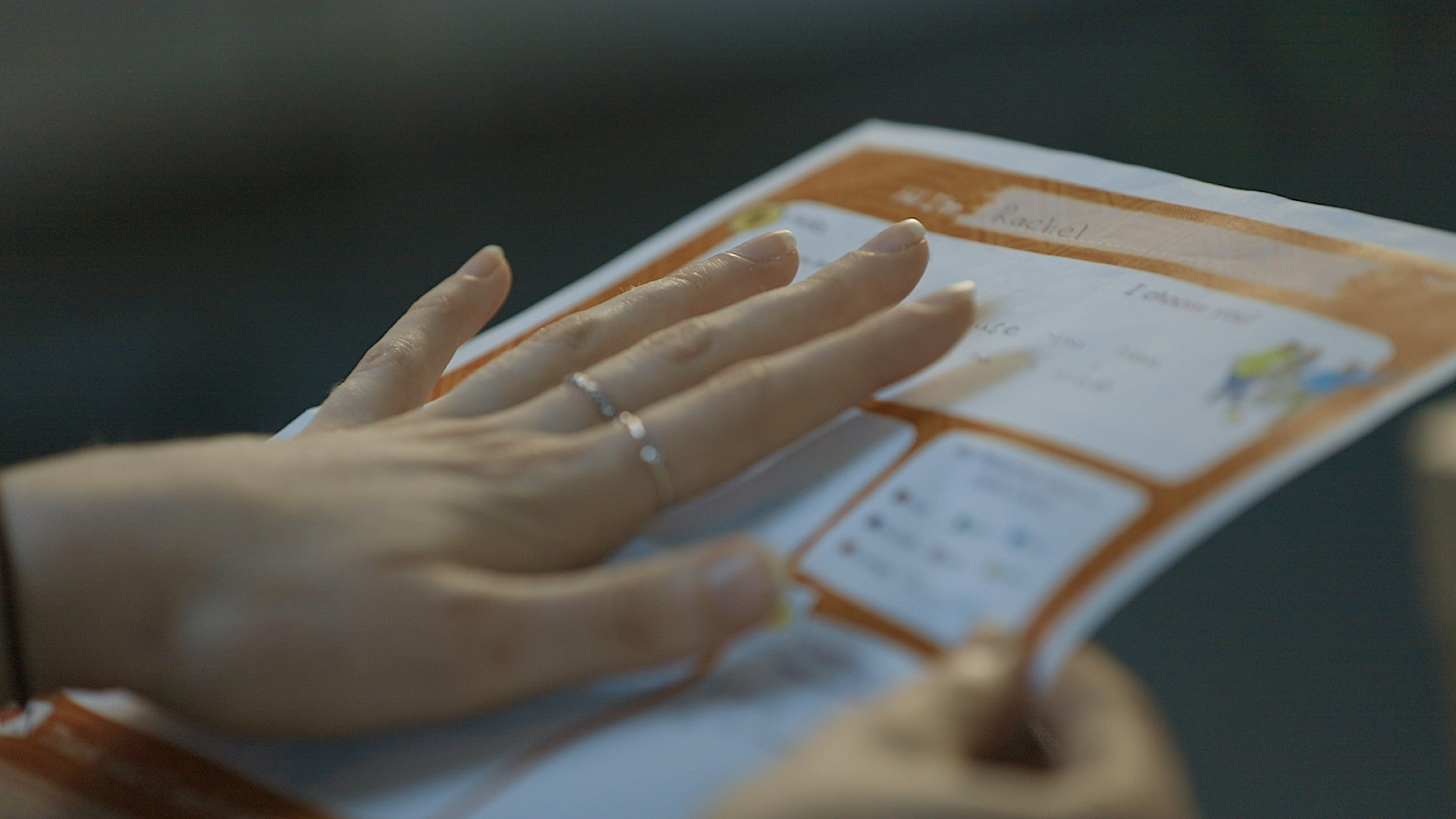A sponsor looks at a letter from their sponsored child