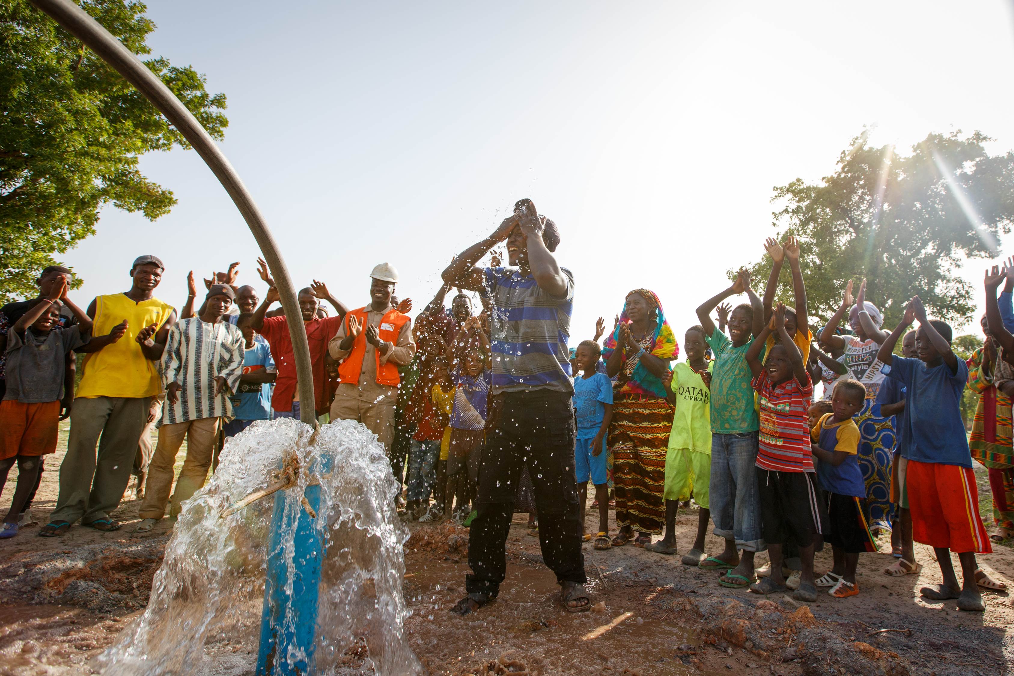 Entire community in Mali dances in celebration at a water pump opening ceremony that will transform the community