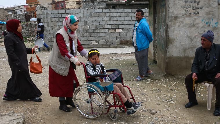 Raja in her wheelchair