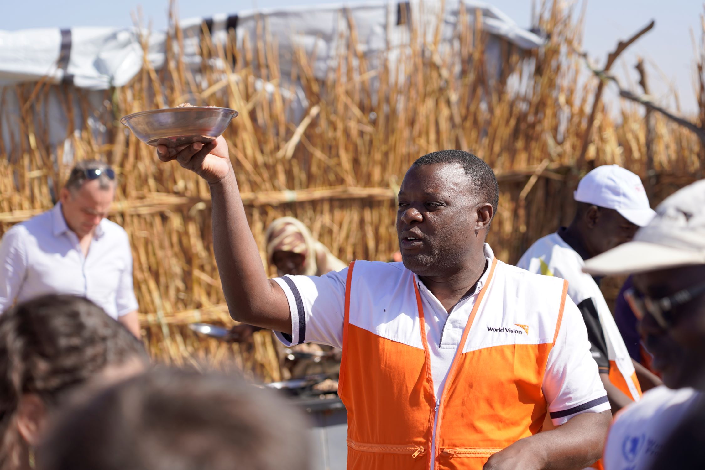 World Vision Sudan staff member with others