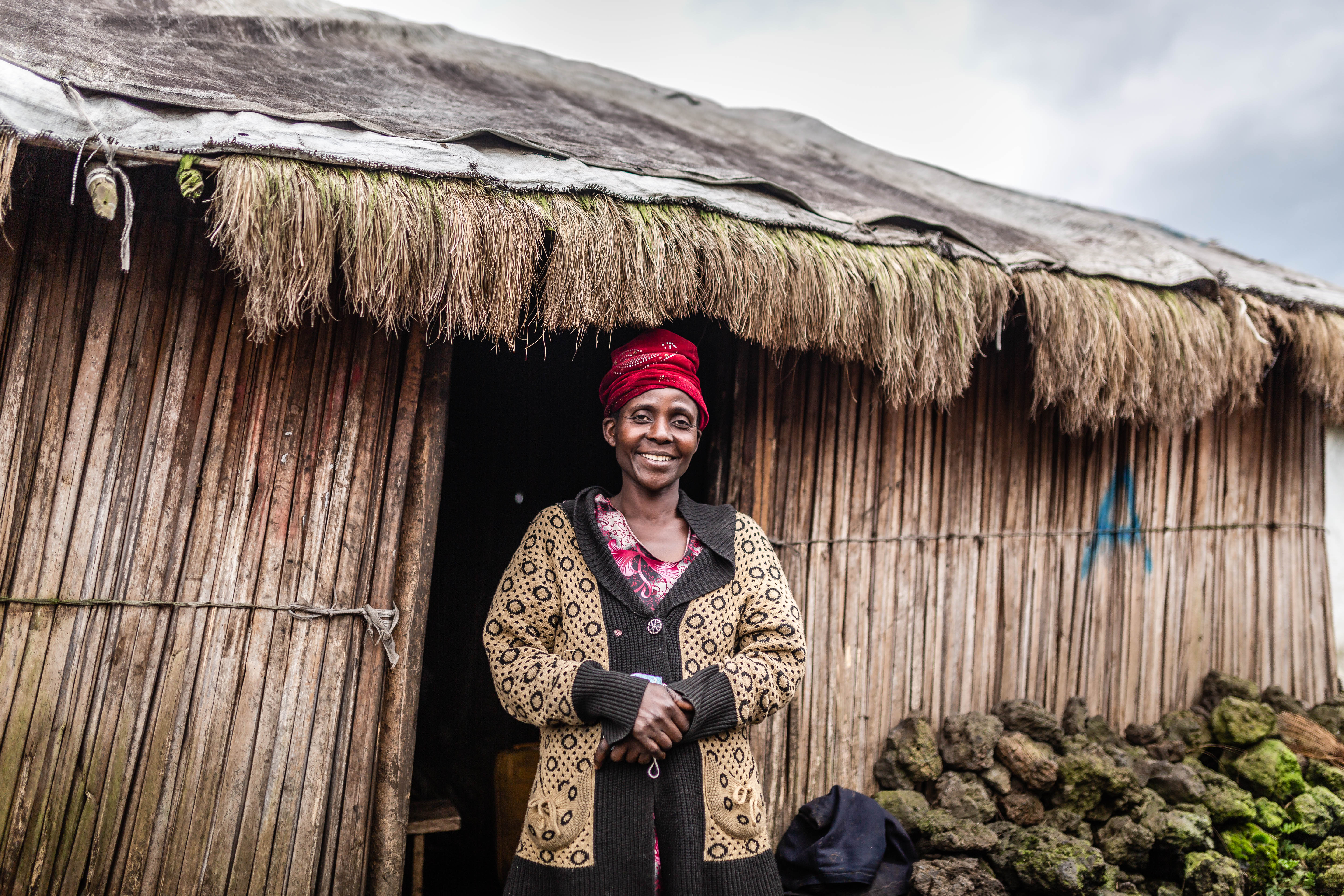 Asifiwe stood outside her home in DRC