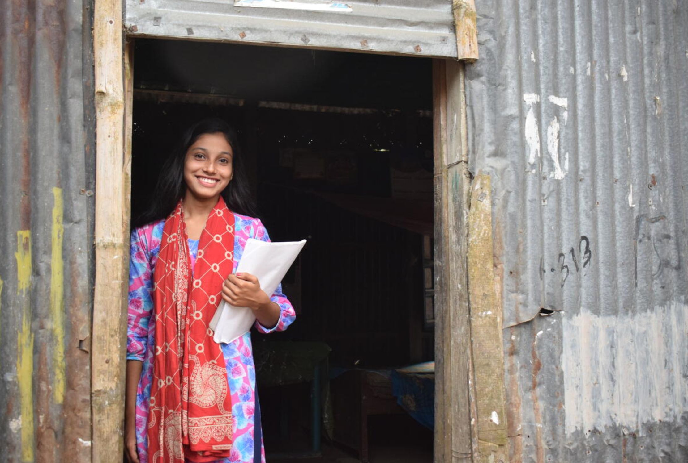 A girl from Bangladesh smiling 