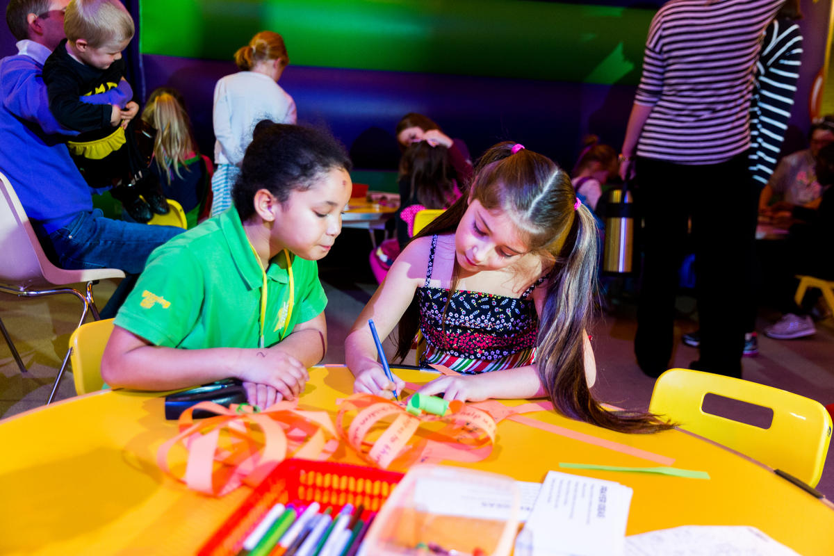 Young girls in church with World Vision activities