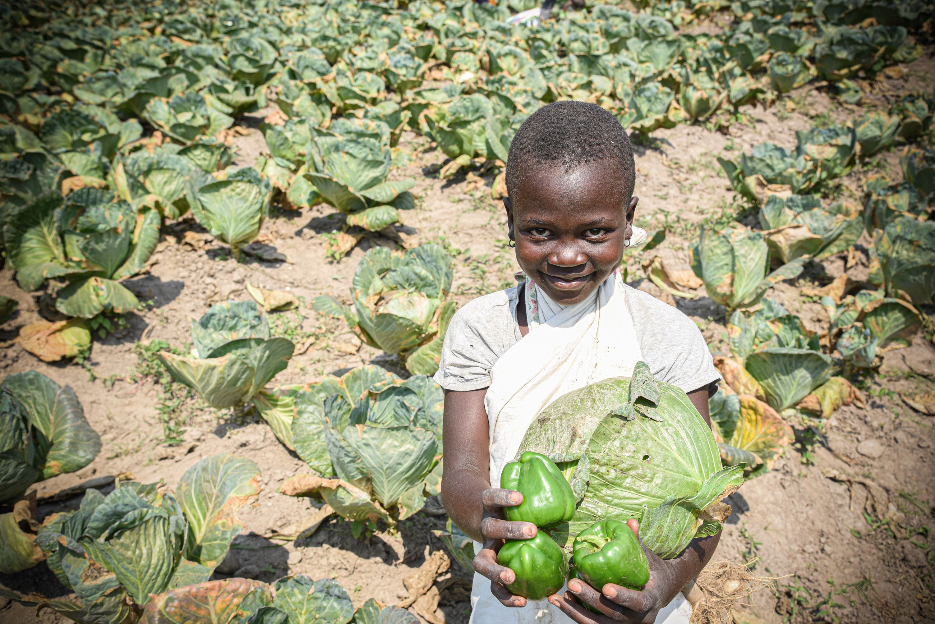 Estha with her favourite vegetable, cabbage.